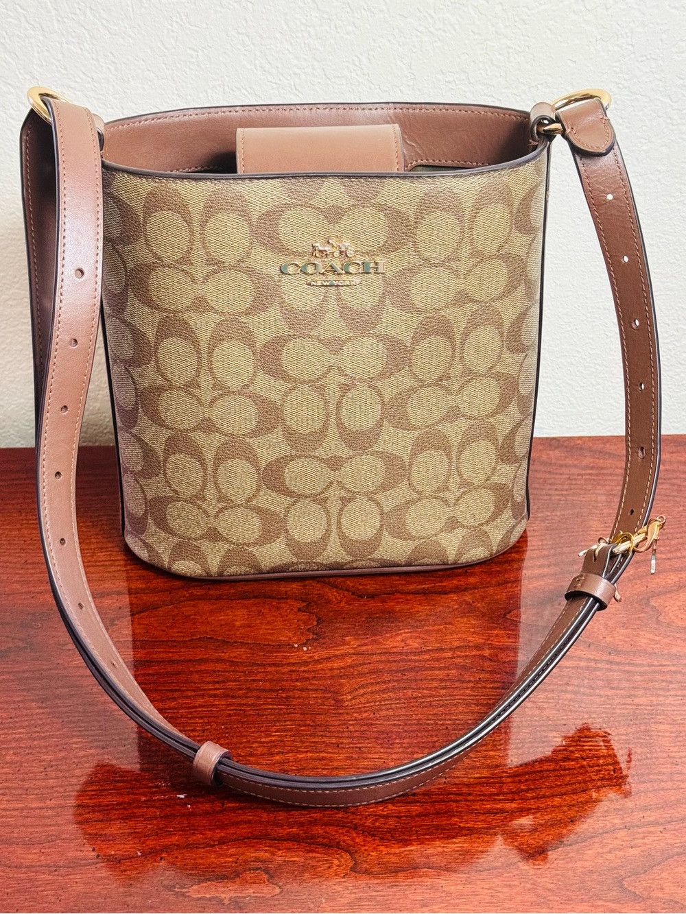 COACH Sophie Signature Canvas Bucket Bag in Brown.